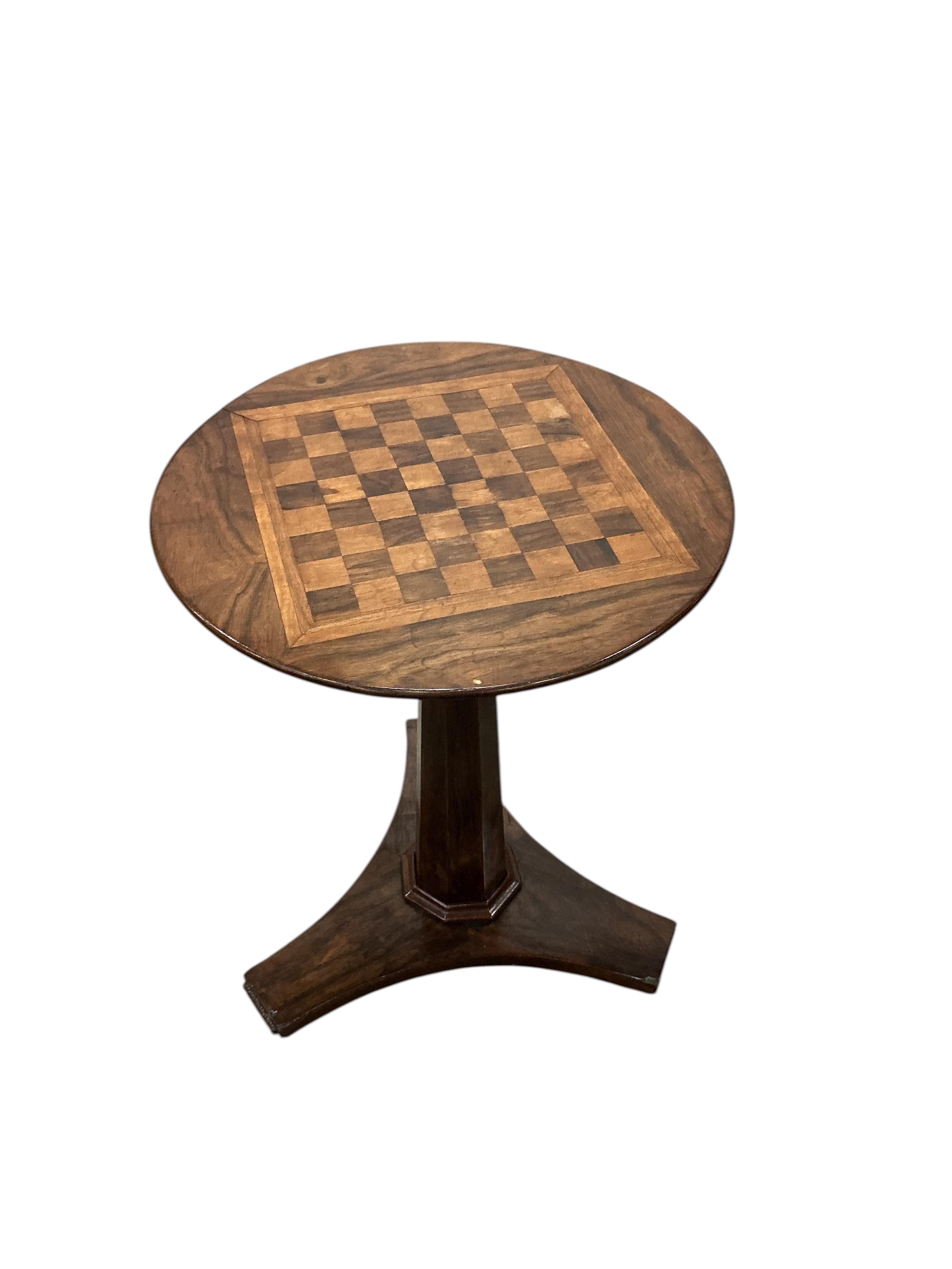 An early Victorian circular rosewood games table with chess board top, diameter 45cm, height 61cm
